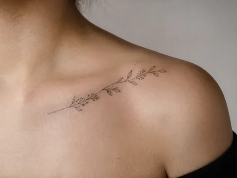 Fine line shoulder tattoo used as a booking reference